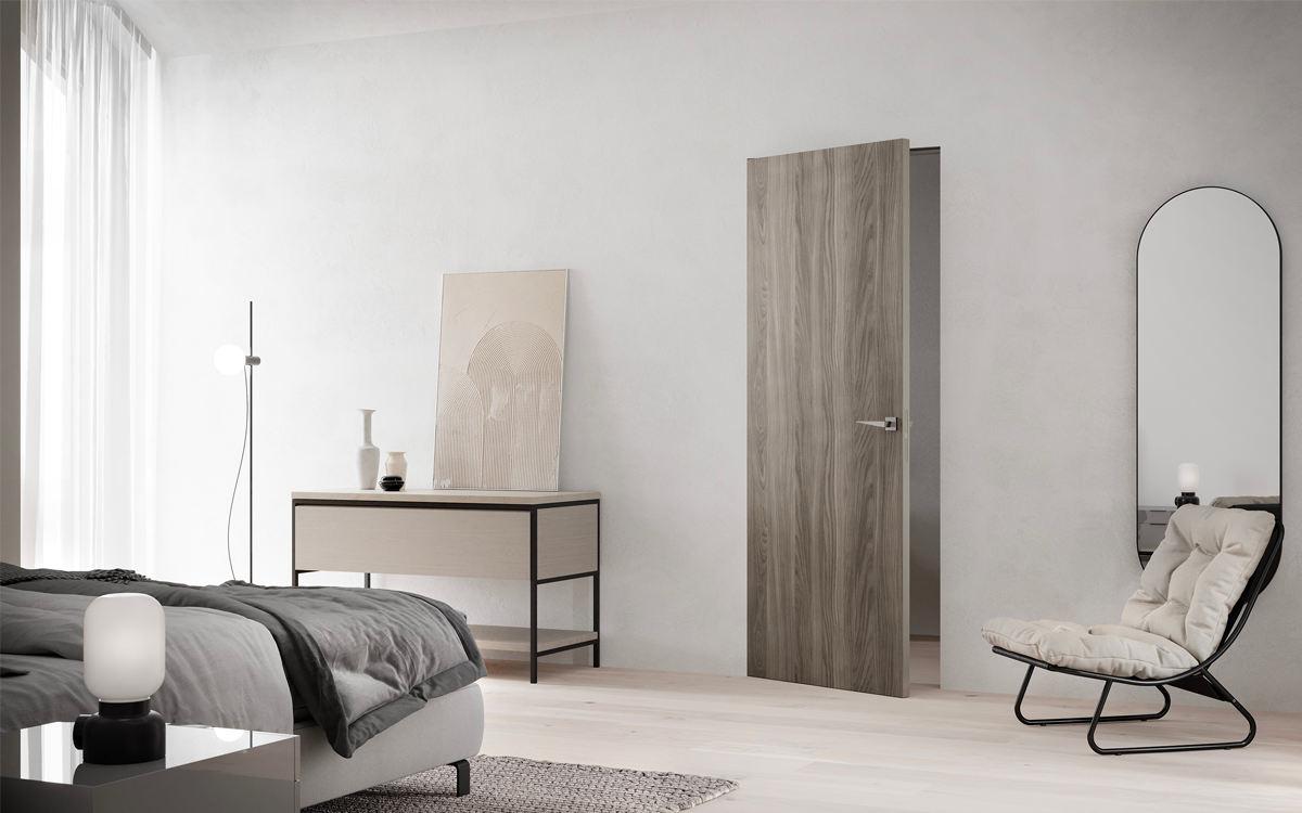 Porte filomuro effetto legno di Emertika: la finitura Olmo grigio della collezione Echo.